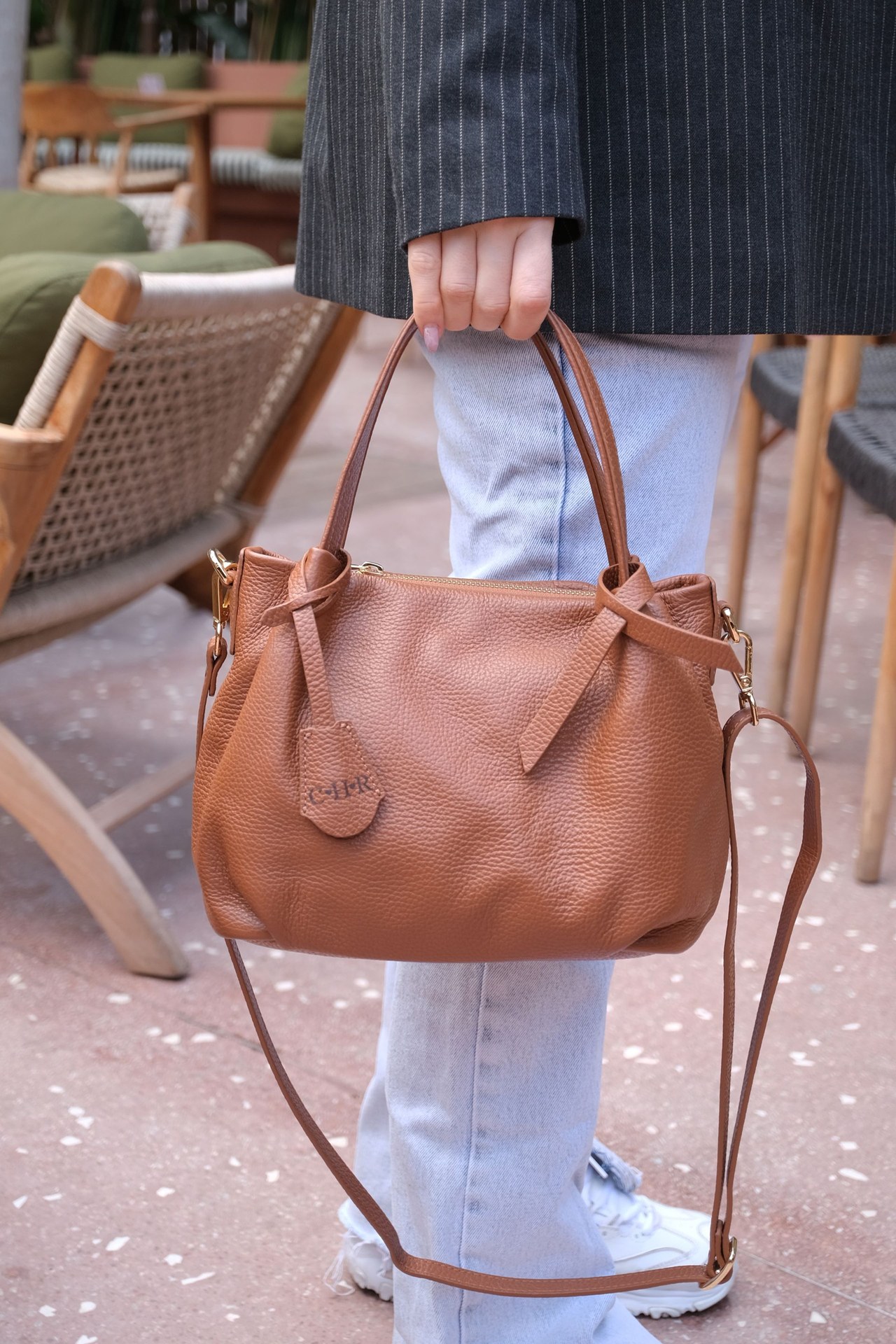 Close-up of full-grain cowhide leather texture on women leather bag