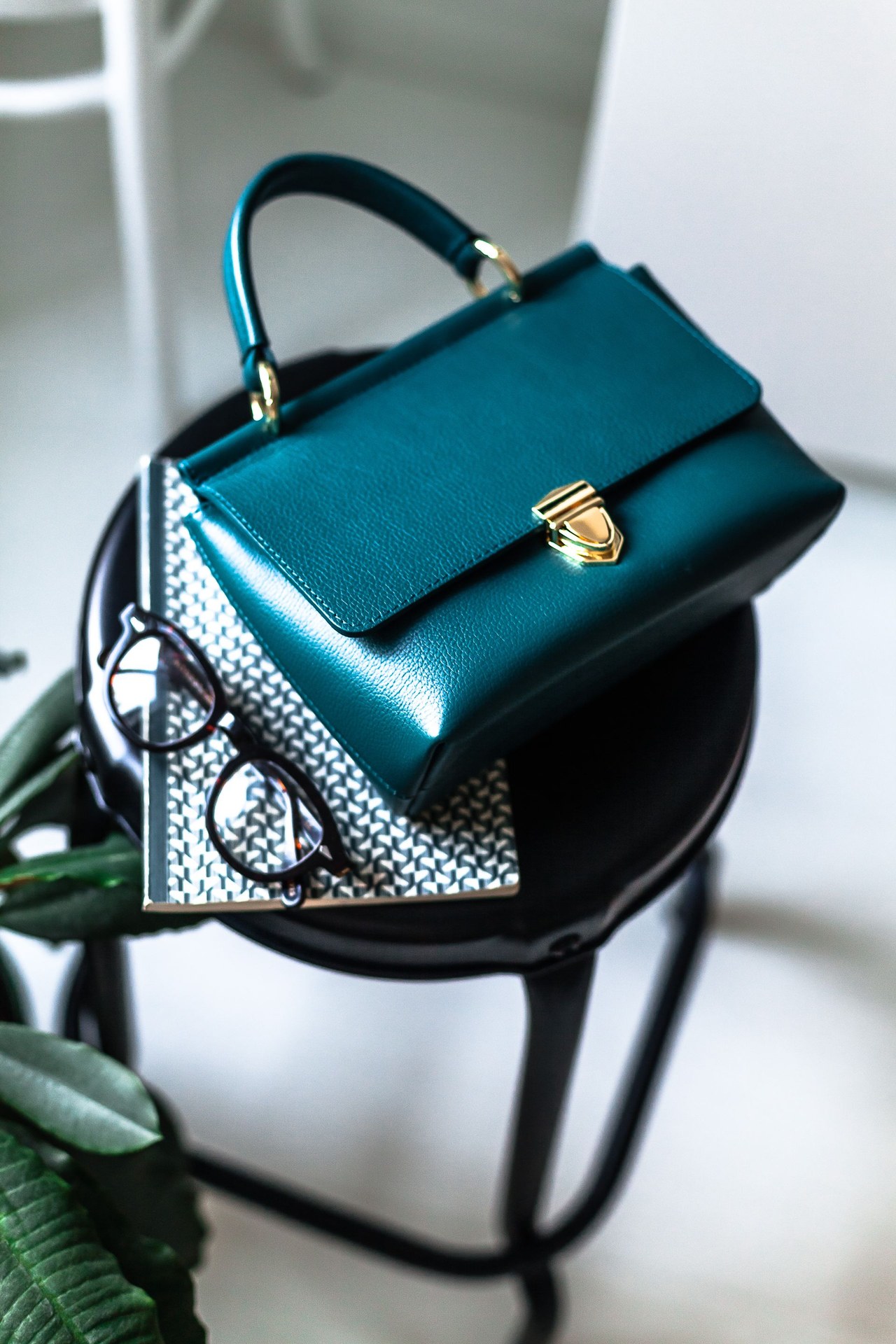 Factory production line showing hand-stitched leather handbag assembly